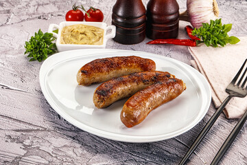 Delicous natural roasted sausages in the plate