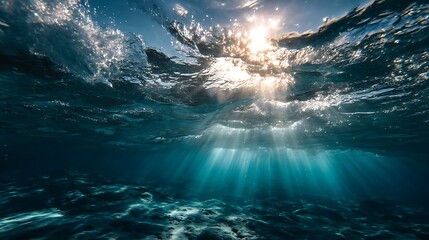 Underwater view with sun rays shining through water
