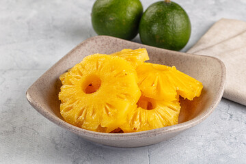 Sweet canned pineapple slices in syrope