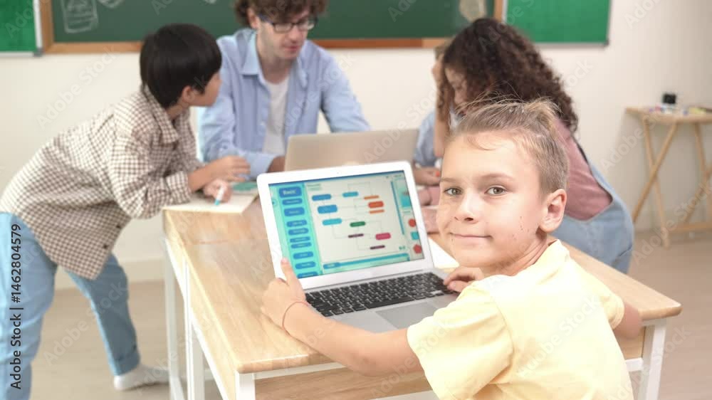Aufkleber cute caucasian boy coding program and looking at camera in stem technology class while group of dive