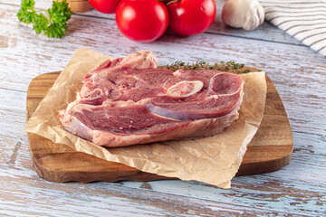 Raw lamb steak with bone