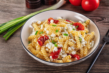Italian pasta fusili with curd