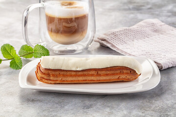 White vanilla eclair with icing