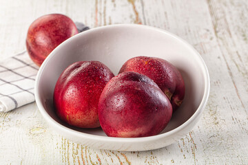 Ripe sweet juicy nectarines heap