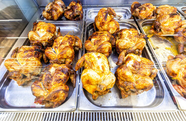 Showcase with tasty fried chicken meat