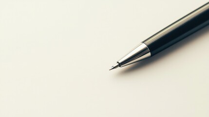 A pen is sitting on a white surface