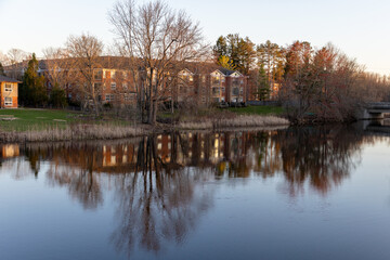 Fototapeta premium Amsterdam Netherlands dancing houses over river Amstel landmark in old european city spring landscape.