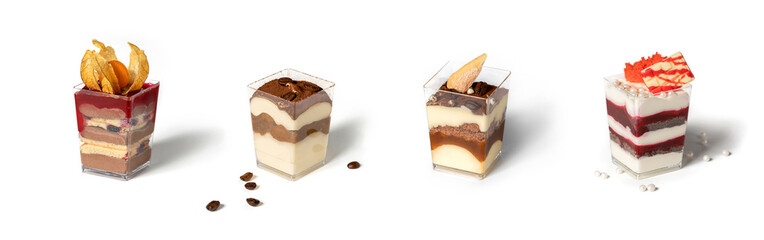 Set of mousse pudding with biscuit cake, berries, chocolate and nuts on white background. Candy bar, sweets and dessert