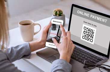 Unrecognizable business woman holding smartphone, scanning qr code from laptop screen, cropped. Closeup of mobile phone screen with bar code in female hands, paying for goods and services from office