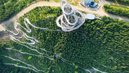 Winding Forest Trails and Spiral Observation Tower in Mountain Landscape