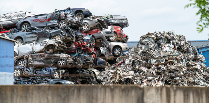Pile of crushed cars in a junkyard. Car recycling.