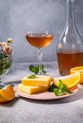 Orange flavored white chocolate bars with rose wine and fresh mint