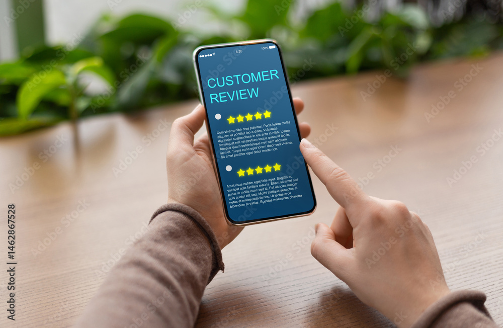 Poster consumer showing cell phone with five star for satisfaction rating on blue screen, blurred backgroun