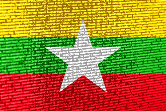 Flag of Myanmar over digital code. Concept of cybersecurity, innovation, and digital infrastructure in Myanmar. Modern tech development trends in Myanmar. Programming, digital sovereignty and site de