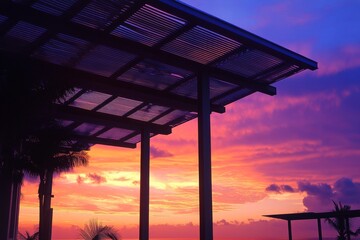 Fototapeta premium Colorful sunset view through a modern pergola.