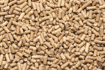 Wood pellets closeup for cat litter, background texture
