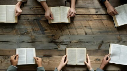 A group of individuals are studying together, each holding an open book. The setting is a rustic wooden table, symbolizing community, shared knowledge, and devotion in an overhead view.