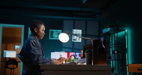 Freelancing admin in home office using laptop to write programming language code. Software technician working from home using notebook device to build application, camera B