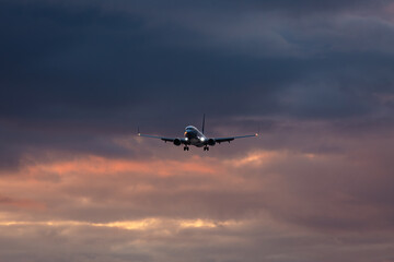 A jet descends toward Anchorage, Alaska, preparing to land.