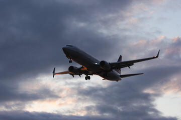 A jet descends toward Anchorage, Alaska, preparing to land.