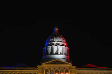 The Missouri State Capitol building, lit in red, white, and blue, for the Fourth of July.