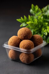 Crispy Fried Bites: Golden-Brown Delights in Clear Container