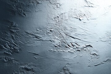 Fototapeta premium Dramatic and textured silver surface with strong lighting highlighting depth and dimension, creating a unique and modern industrial aesthetic element.