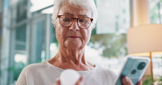Senior, happy woman or phone with medication for research, symptoms or side effects at home. Elderly, female person or patient with mobile smartphone or pharmaceuticals for prescription or health app