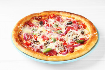 Tasty pizza with thin smoked sausages on white wooden table, closeup