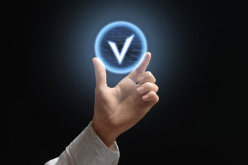 Approved. Woman holding virtual check mark against black background, closeup