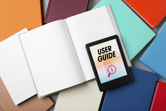 User Guide document open in e-book device and many different books, to view