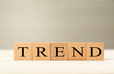 Word Trend made of wooden cubes with letters on table