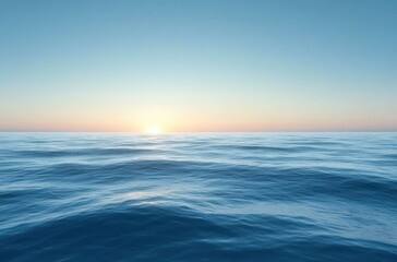 Obraz premium Calm ocean waves stretching to the horizon under a clear sky with the sun rising or setting, evoking tranquility and peacefulness