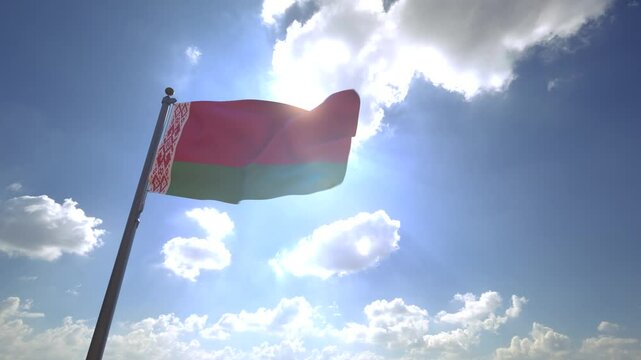 Belarus Flag waving on a Flagpole from a Moving Angle in front of a blue sky with clouds	