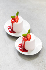 Strawberry cream pudding, Panna Cotta cylindrical shape. With strawberry sauce. Top view