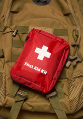 Naklejka premium First Aid Kit on army backpack