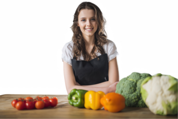 Happy young woman chef posing with fresh vegetables colorful bell peppers on transparent background