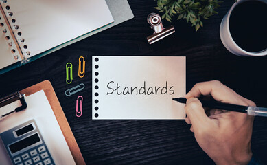 There is notebook with the word Standards. It is as an eye-catching image.