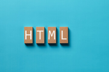 There is wood block with the word HTML. It is an abbreviation for Hyper Text Markup Language as...