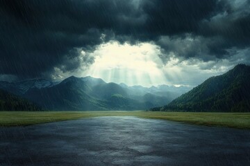 Dark stormy sky with heavy rain over a wide open plain surrounded by green forested mountains and distant snow-capped peaks illuminated by rays of sunlight breaking through clouds