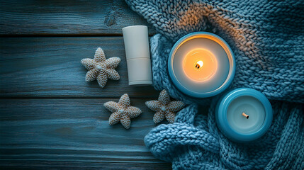 Blue Candles and Cozy Knitwear on Rustic Wooden Background