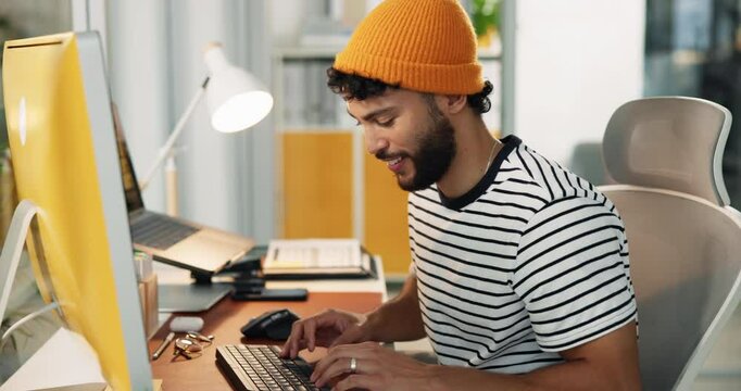 Man, creative and typing at computer with smile, digital animator and software for design at desk. Productivity, happiness and keyboard with visual effects or animation process at startup workplace
