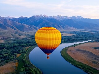Fototapeta premium Hot air balloon over a scenic river valley
