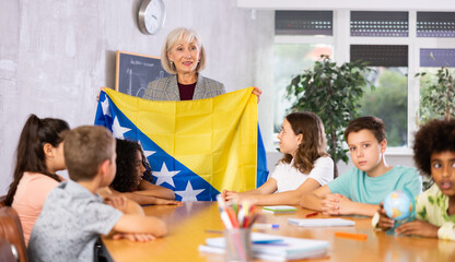 Kids learning together about bosnia in geography class