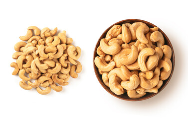 Roasted cashew nuts in wooden bowl isolated on white background. Top view
