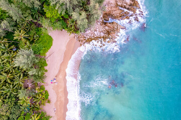 Aerial Top view beach background,Amazing beach with waves crashing on sandy shore,Top view nature sea sand background