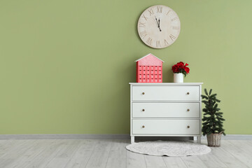 Interior of room with commode, Advent calendar and Christmas plant poinsettia