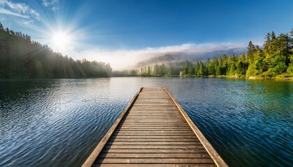 Naklejka premium a serene wooden dock extends into a tranquil lake surrounded by nature