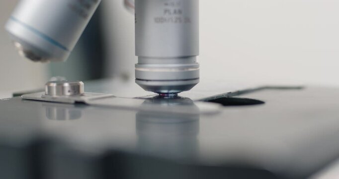 Scientific microscope during research, analyzing data in the lab, research for vaccine production. Concept of biological sciences, viruses and treatment. 