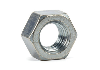A close up shot of a single metal hex nut with visible threads on a plain white background surface